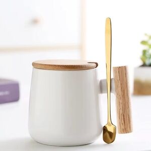 White Ceramic Mug with Gold Spoon and Wooden Lid